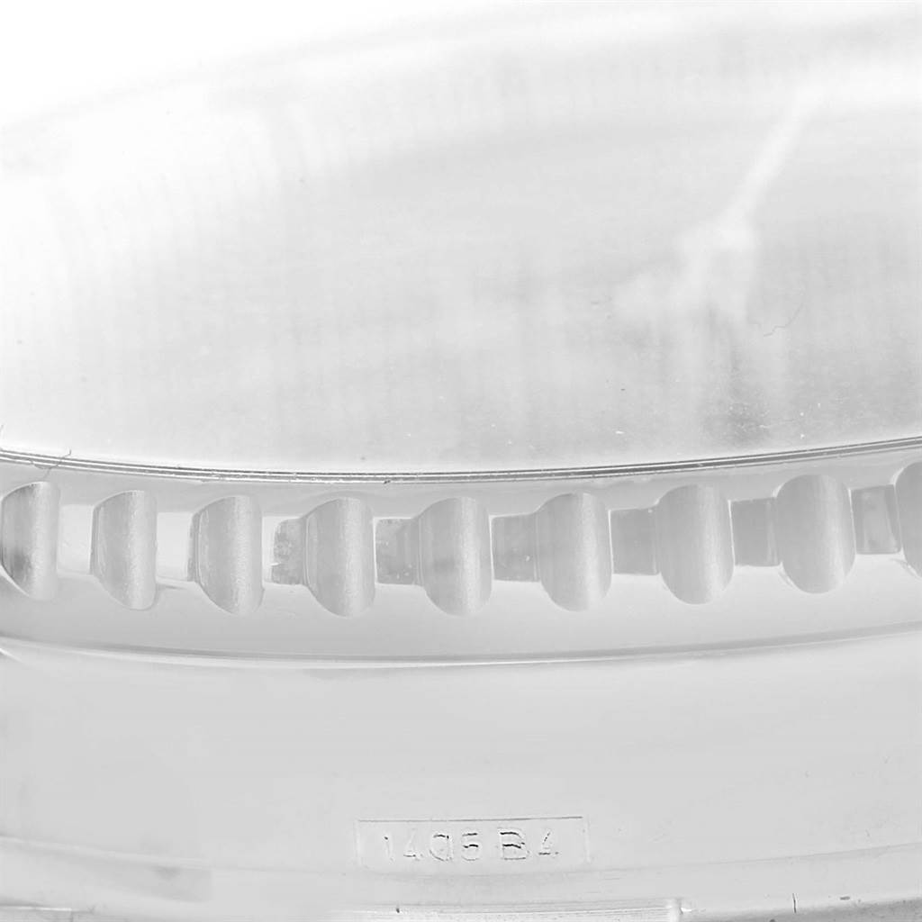 This image shows a close-up angle of the bezel and part of the case on a Breitling Navitimer A23322 Men's Stainless Steel Blue Dial A23322 Men's Stainless Steel Blue Dial watch.