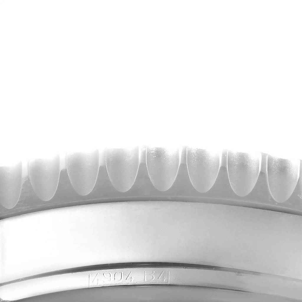 The image shows a close-up of the bezel and part of the case of a Breitling Navitimer A21330 Men
s Stainless Steel Brown Dial A21330 Men
s Stainless Steel Brown Dial watch.