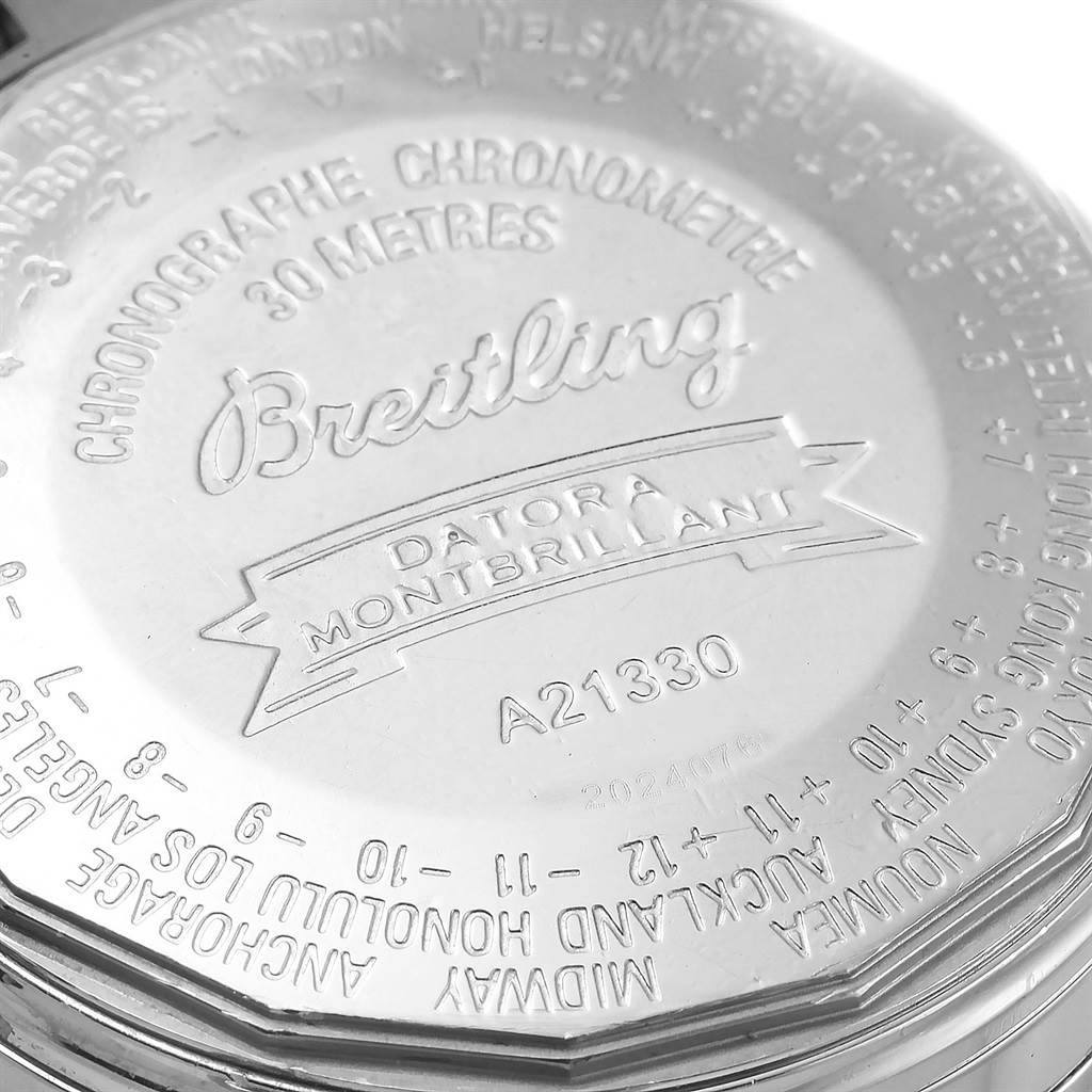 This image shows the back case of a Breitling Navitimer A21330 Men
s Stainless Steel Brown Dial A21330 Men
s Stainless Steel Brown Dial Datora Montbrillant watch, highlighting its engravings.