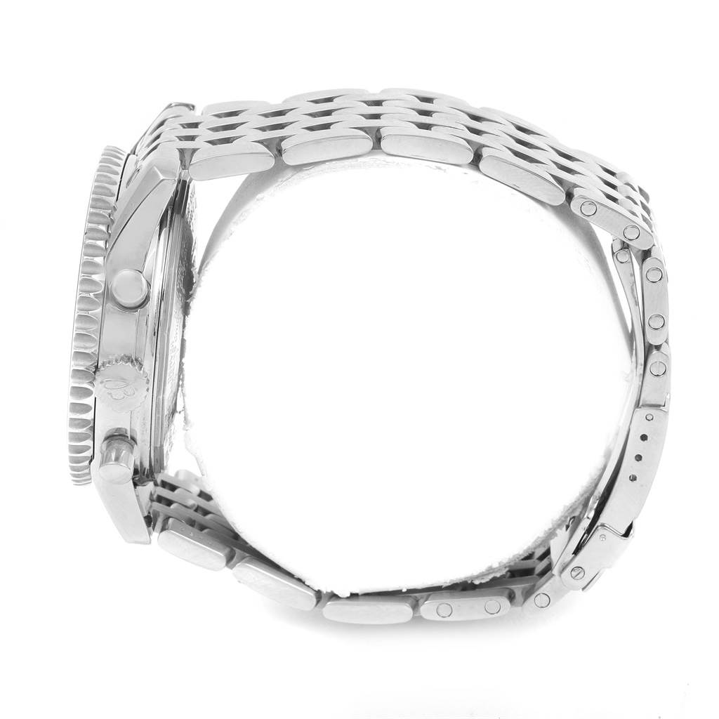 The image shows a side view of the Breitling Navitimer A21330 Men
s Stainless Steel Brown Dial A21330 Men
s Stainless Steel Brown Dial watch, highlighting its bezel, crown, and metal bracelet.