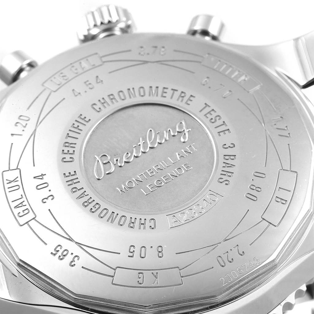 This image shows the back case of a Breitling Navitimer A23340 Men
s Stainless Steel Brown Dial A23340 Men
s Stainless Steel Brown Dial Montbrillant Legende watch, displaying engravings and conversion scales.