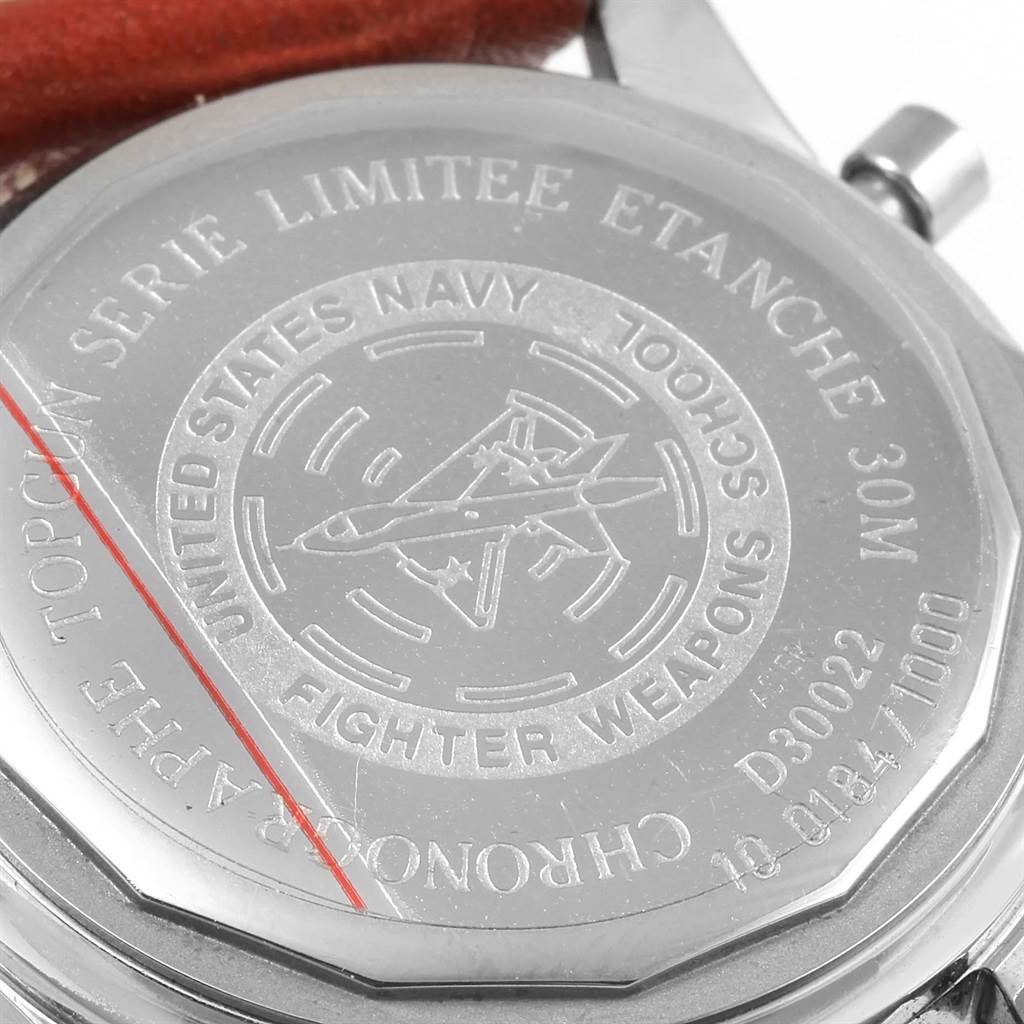 This image shows the case back of a Breitling Navitimer D30022 Men's Stainless Steel Silver Dial D30022 Men's Stainless Steel Silver Dial watch, featuring engraved markings and a partial view of the strap.