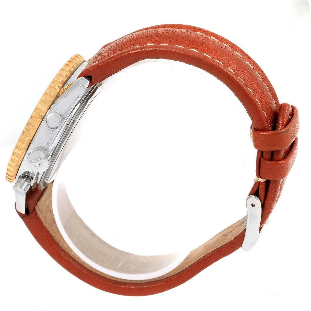 The image shows a side angle of a Breitling Navitimer D30022 Men's Stainless Steel Silver Dial D30022 Men's Stainless Steel Silver Dial watch, focusing on the case, crown, bezel, and brown leather strap with a buckle.