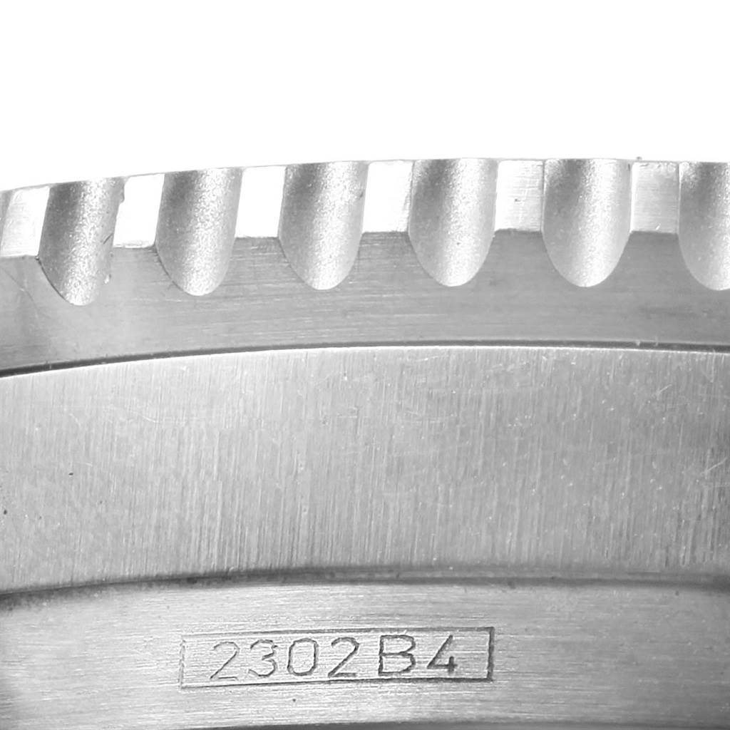 Close-up image of the bezel and engraved serial number "2302 B4" on a Breitling Navitimer A41322 Men's Stainless Steel Silver Dial A41322 Men's Stainless Steel Silver Dial watch.