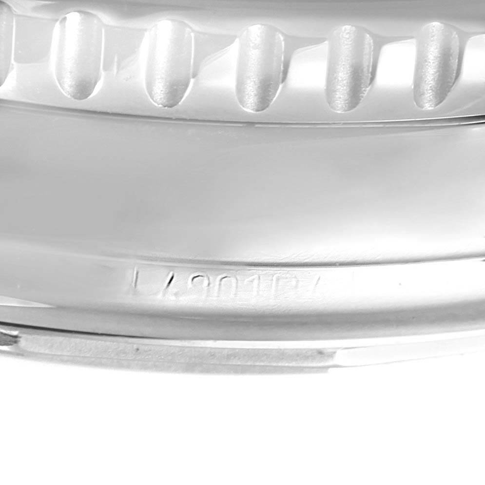 This close-up image shows the bezel and a portion of the case back of a Breitling Navitimer A13322 Men's Stainless Steel Blue Dial A13322 Men's Stainless Steel Blue Dial watch.