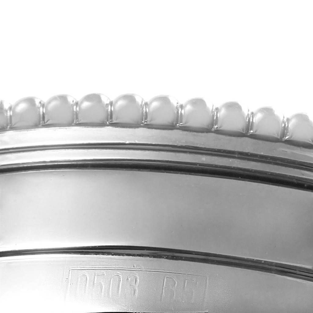 This image shows a close-up of the bezel and the case edge of a Breitling Navitimer A35330 Men
s Stainless Steel Black Dial A35330 Men
s Stainless Steel Black Dial watch.
