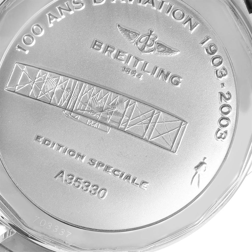 The image shows the back case of a Breitling Navitimer A35330 Men
s Stainless Steel Black Dial A35330 Men
s Stainless Steel Black Dial watch, featuring engravings commemorating aviation history.