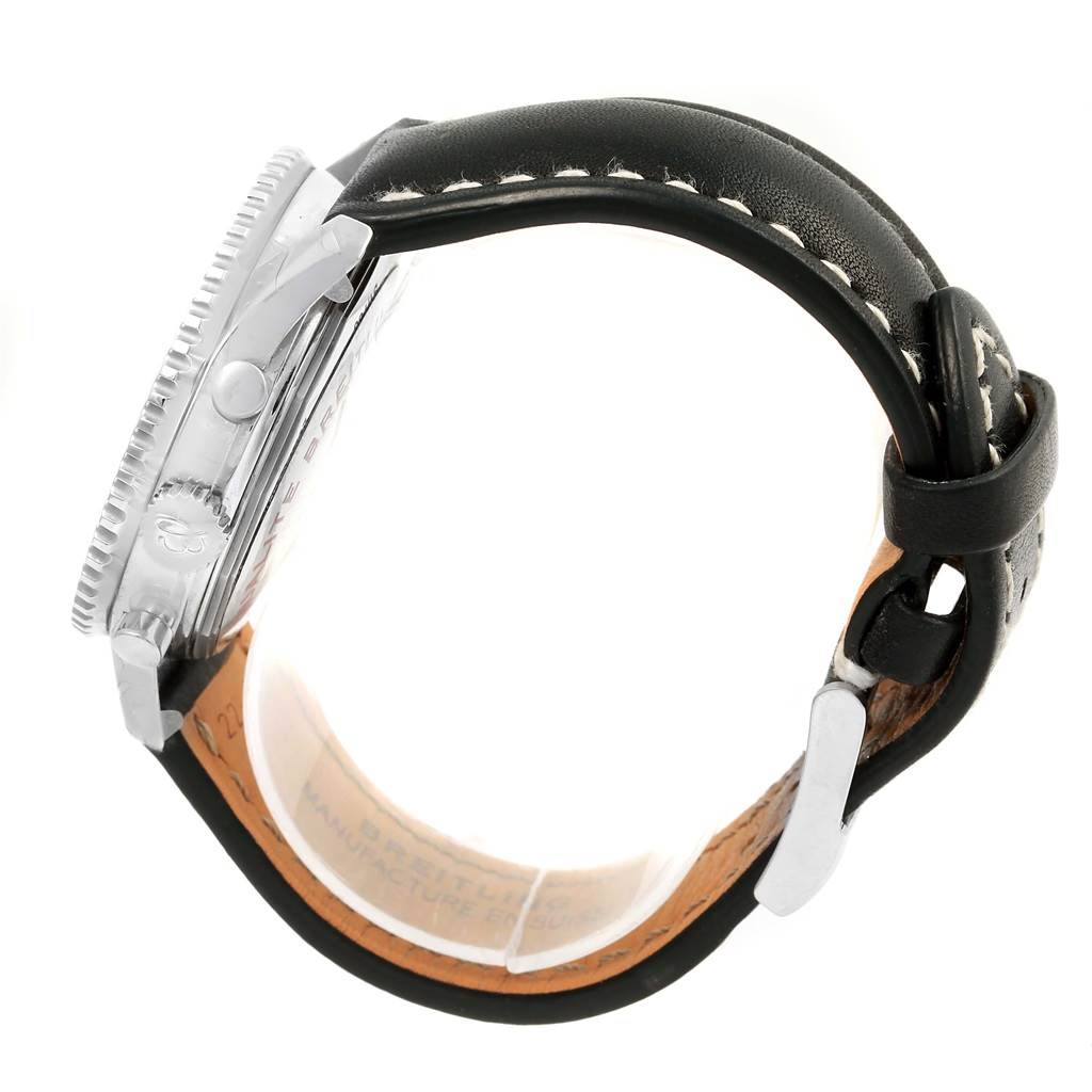 The image shows a side view of a Breitling Navitimer A23322 Men's Stainless Steel Black Dial A23322 Men's Stainless Steel Black Dial watch, highlighting the case, crown, bezel, and leather strap.