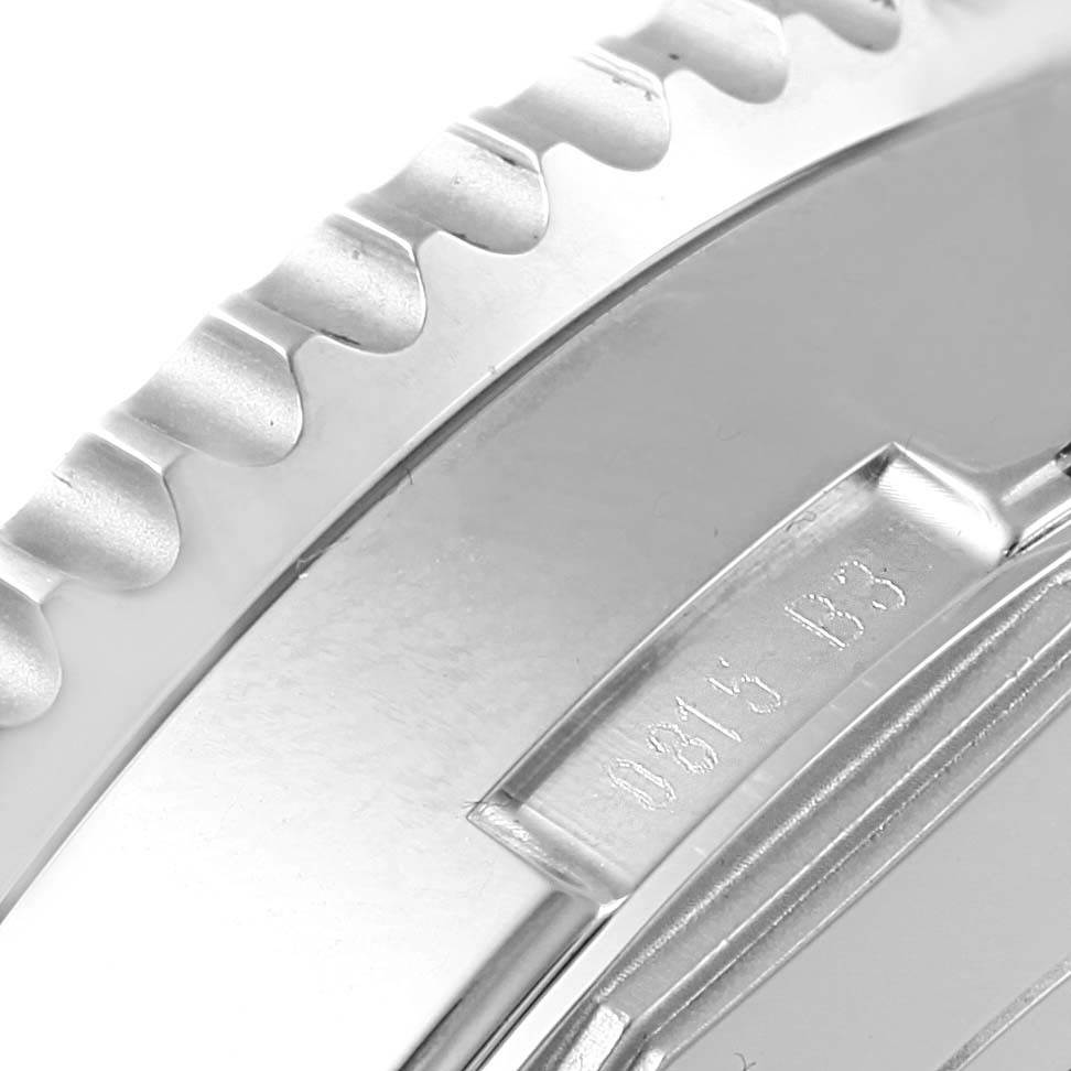 This close-up image shows the side of the Breitling Navitimer AB0127 Men's Stainless Steel Black Dial AB0127 Men's Stainless Steel Black Dial watch, highlighting its serrated bezel and part of the case back inscription.
