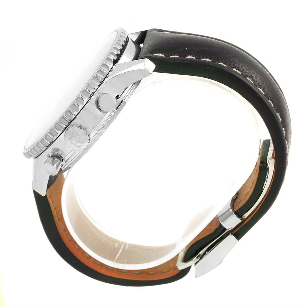 This side view of the Breitling Navitimer AB0127 Men's Stainless Steel Black Dial AB0127 Men's Stainless Steel Black Dial watch shows the bezel, pushers, crown, and leather strap with stitching.