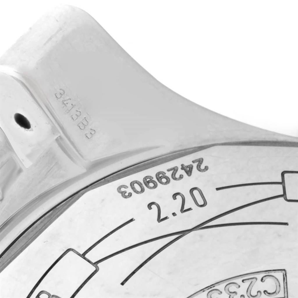 The image shows a close-up detail of the back case of a Breitling Navitimer C23340 Men
s Steel and Gold (two tone) Black Dial C23340 Men
s Steel and Gold (two tone) Black Dial watch, highlighting engravings and a small part of the case structure.
