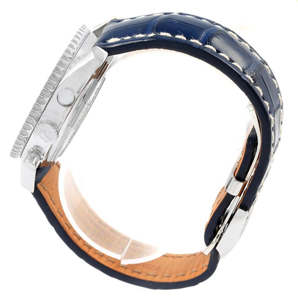This image shows a side view of the Breitling Navitimer AB0130 Men's Stainless Steel Blue Dial AB0130 Men's Stainless Steel Blue Dial watch, focusing on the case, bezel, and a blue leather strap.