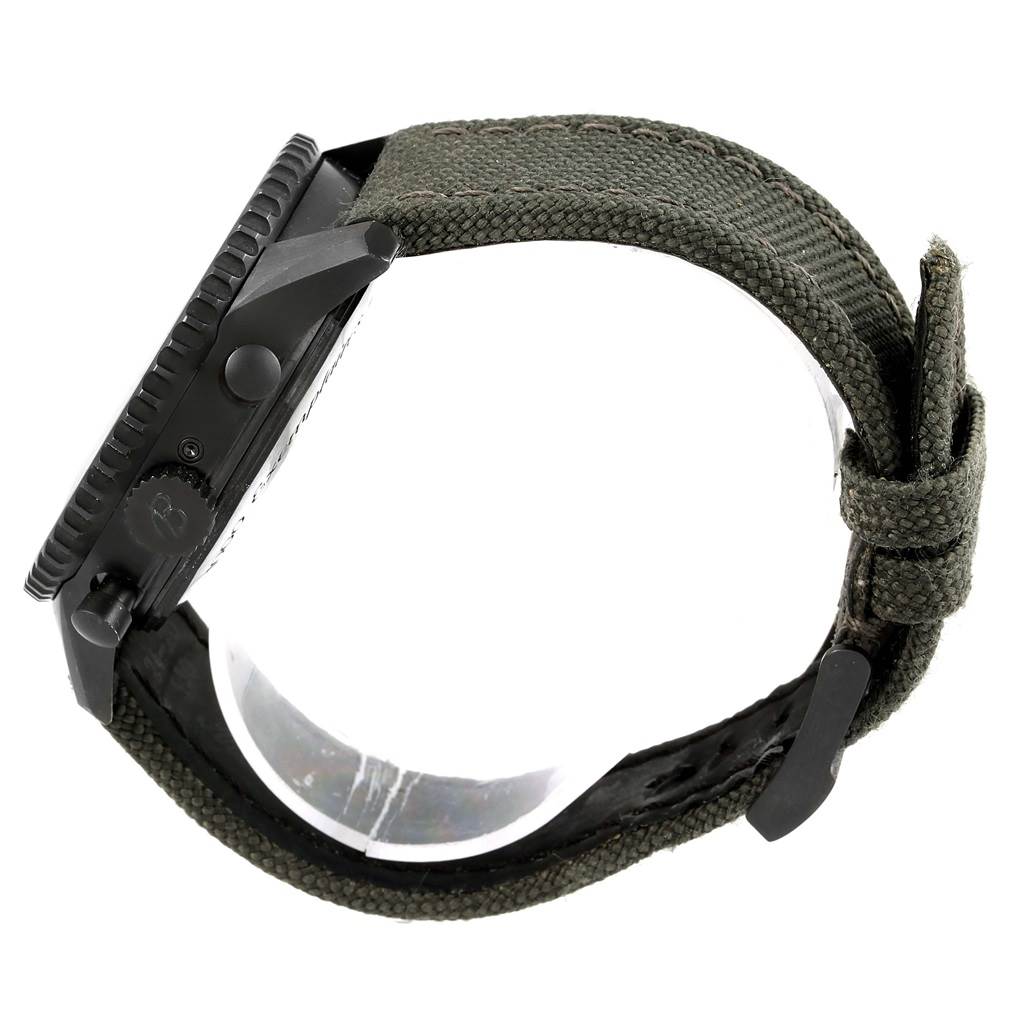 This image shows a side view of a Breitling Navitimer M19380 Men's Stainless Steel Black Dial M19380 Men's Stainless Steel Black Dial watch, highlighting the case, crown, buttons, and fabric strap.