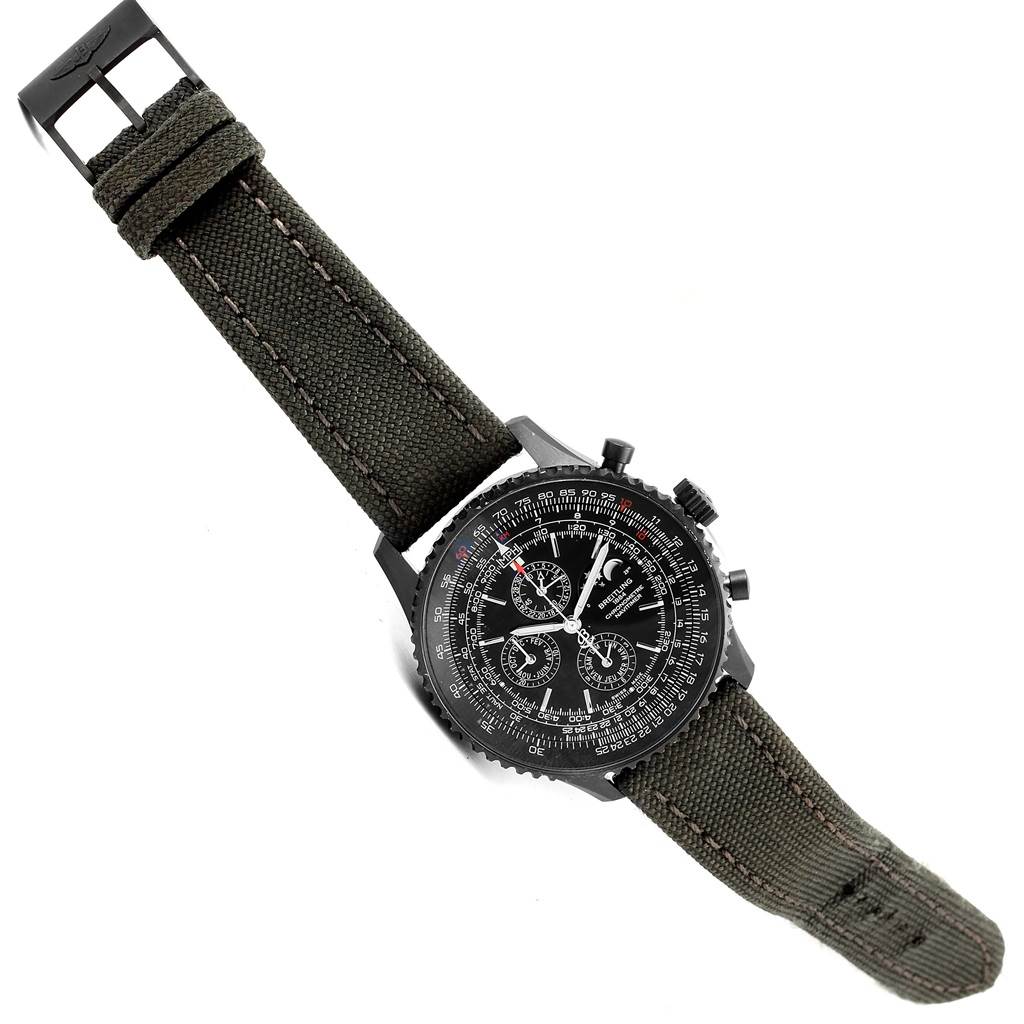 The Breitling Navitimer M19380 Men's Stainless Steel Black Dial M19380 Men's Stainless Steel Black Dial watch is shown at an angled top-down view, highlighting its black dial, chronograph features, and textile strap.