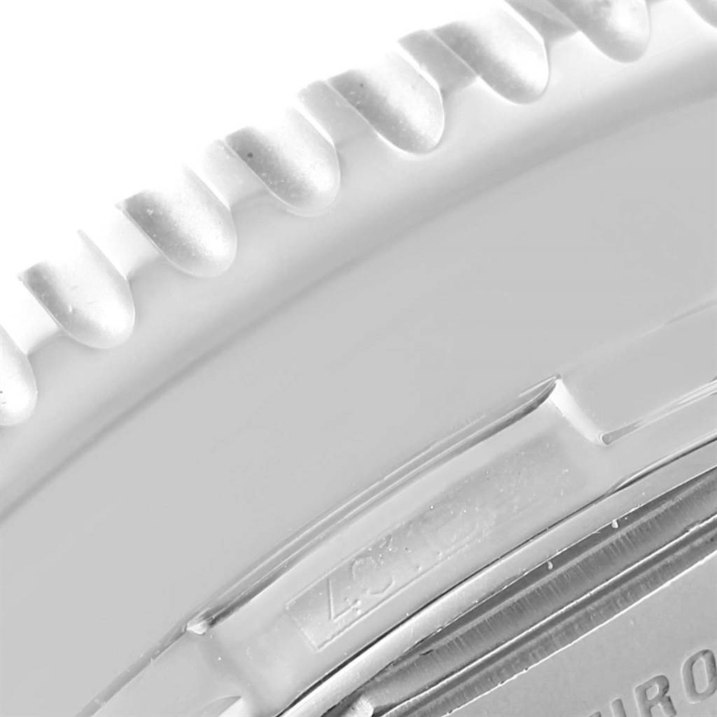The image shows a close-up of the bezel and part of the case back of a Breitling Navitimer A24322 Men's Stainless Steel Blue Dial A24322 Men's Stainless Steel Blue Dial watch.
