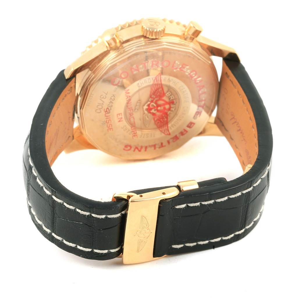The image shows the back view of a Breitling Navitimer K24322 Men's Yellow Gold Black Dial K24322 Men's Yellow Gold Black Dial watch, including the strap and the clasp.