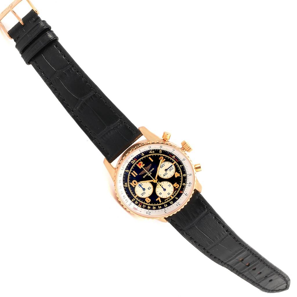 The Breitling Navitimer K30021 Men
s Rose Gold Black Dial K30021 Men
s Rose Gold Black Dial watch is shown from a top-down angle, displaying its black strap, round dial, and gold case.