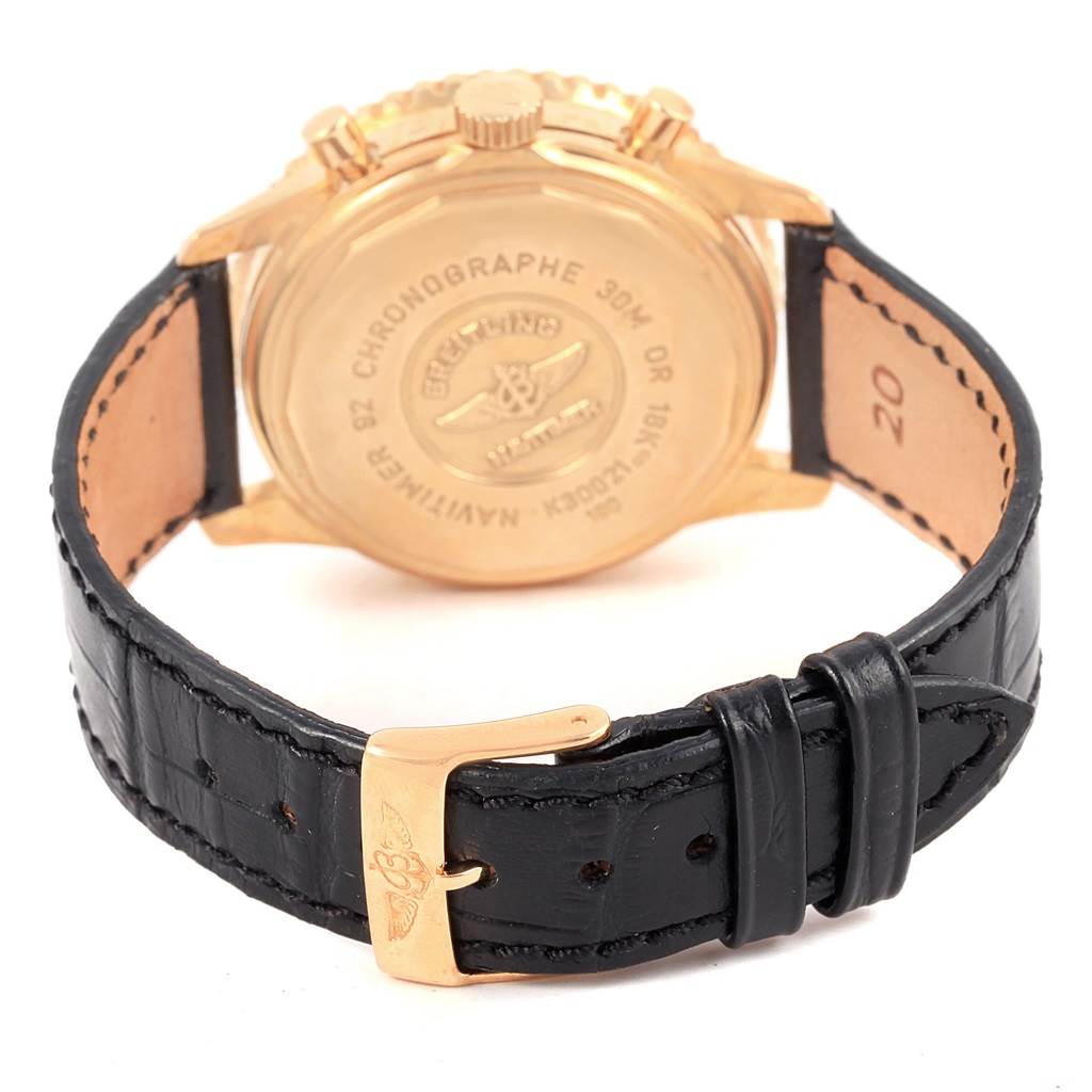 The image shows the back view of a Breitling Navitimer K30021 Men
s Rose Gold Black Dial K30021 Men
s Rose Gold Black Dial watch, including its case back, leather strap, and buckle.