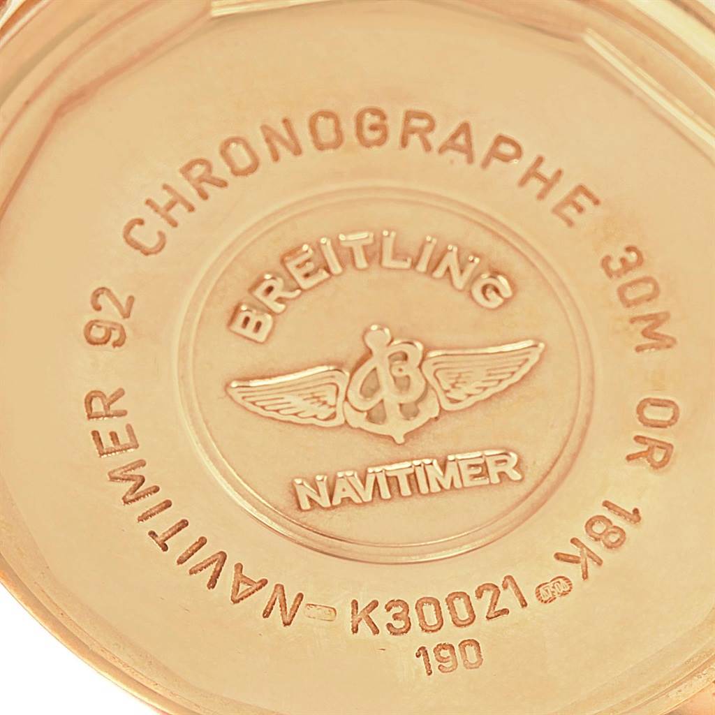 The image shows a close-up of the back case of a Breitling Navitimer K30021 Men
s Rose Gold Black Dial K30021 Men
s Rose Gold Black Dial watch, displaying embossed branding and model information.