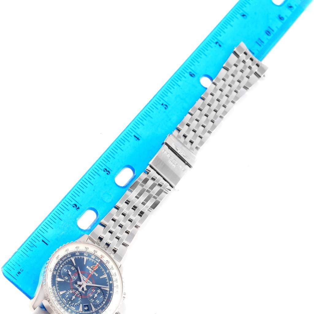 The image shows a Breitling Navitimer AB0130 Men
s Stainless Steel Blue Dial AB0130 Men
s Stainless Steel Blue Dial watch from a top-down angle, displaying the dial and metal bracelet next to a ruler.