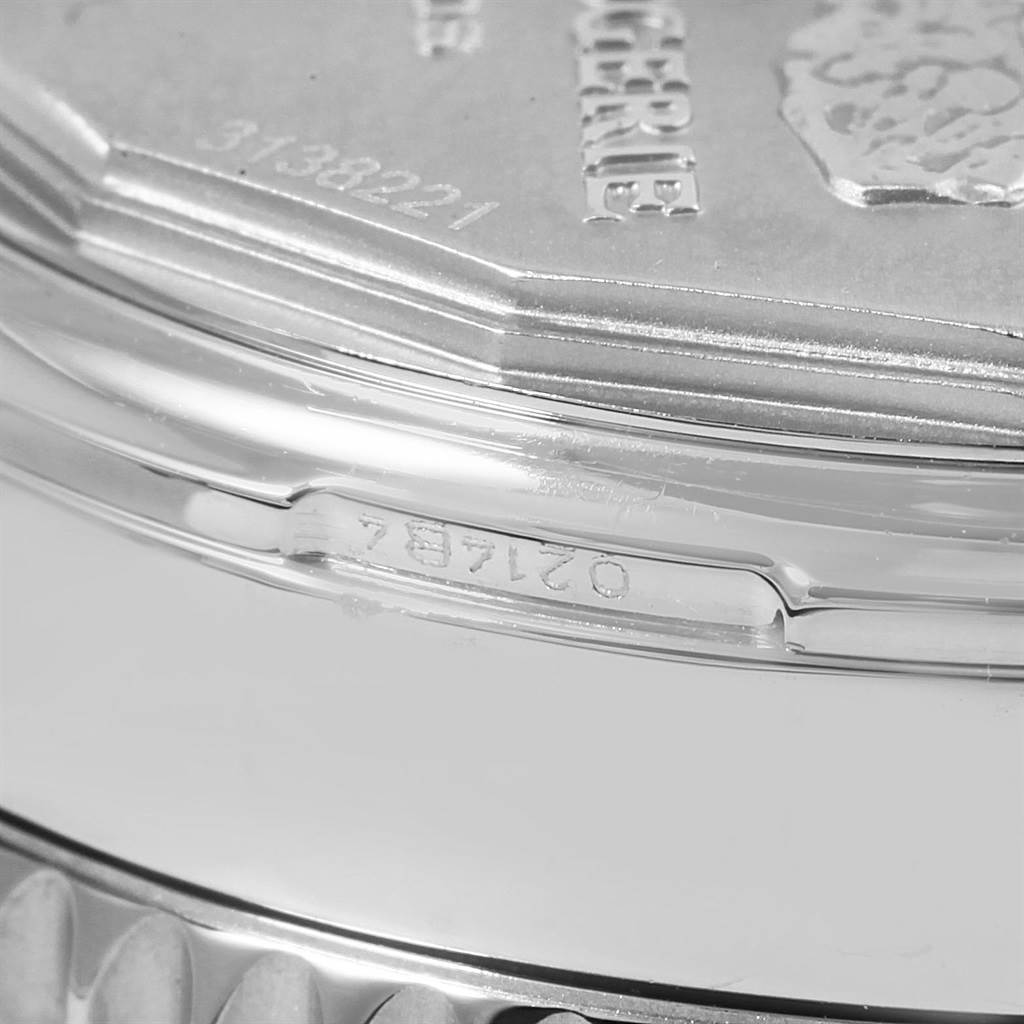 The image shows a close-up of the side and back casing of a Breitling Navitimer AB0130 Men
s Stainless Steel Blue Dial AB0130 Men
s Stainless Steel Blue Dial watch.