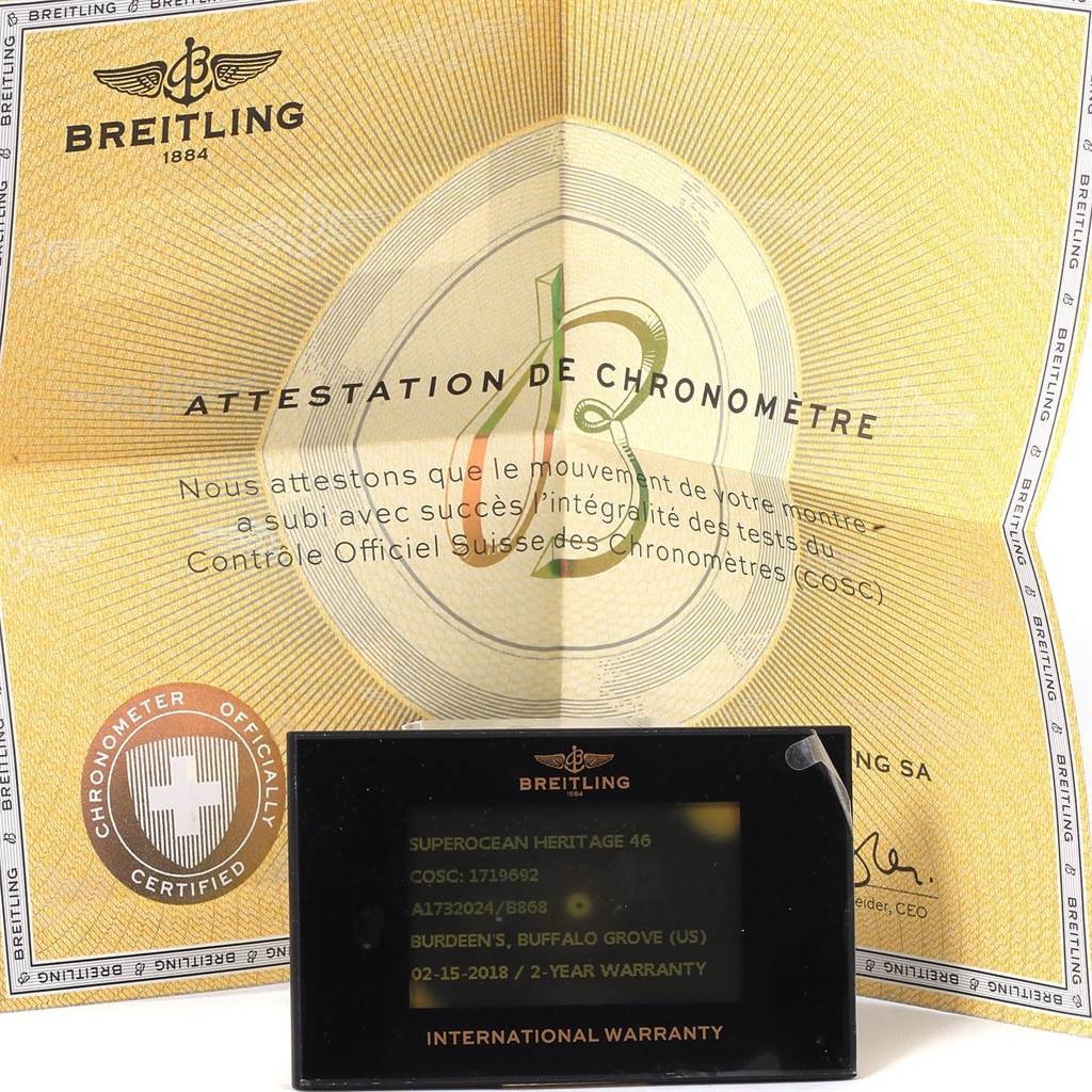 The image shows a Breitling Navitimer A17320 Men
s Stainless Steel Black Dial A17320 Men
s Stainless Steel Black Dial
s chronometer certificate and international warranty card.