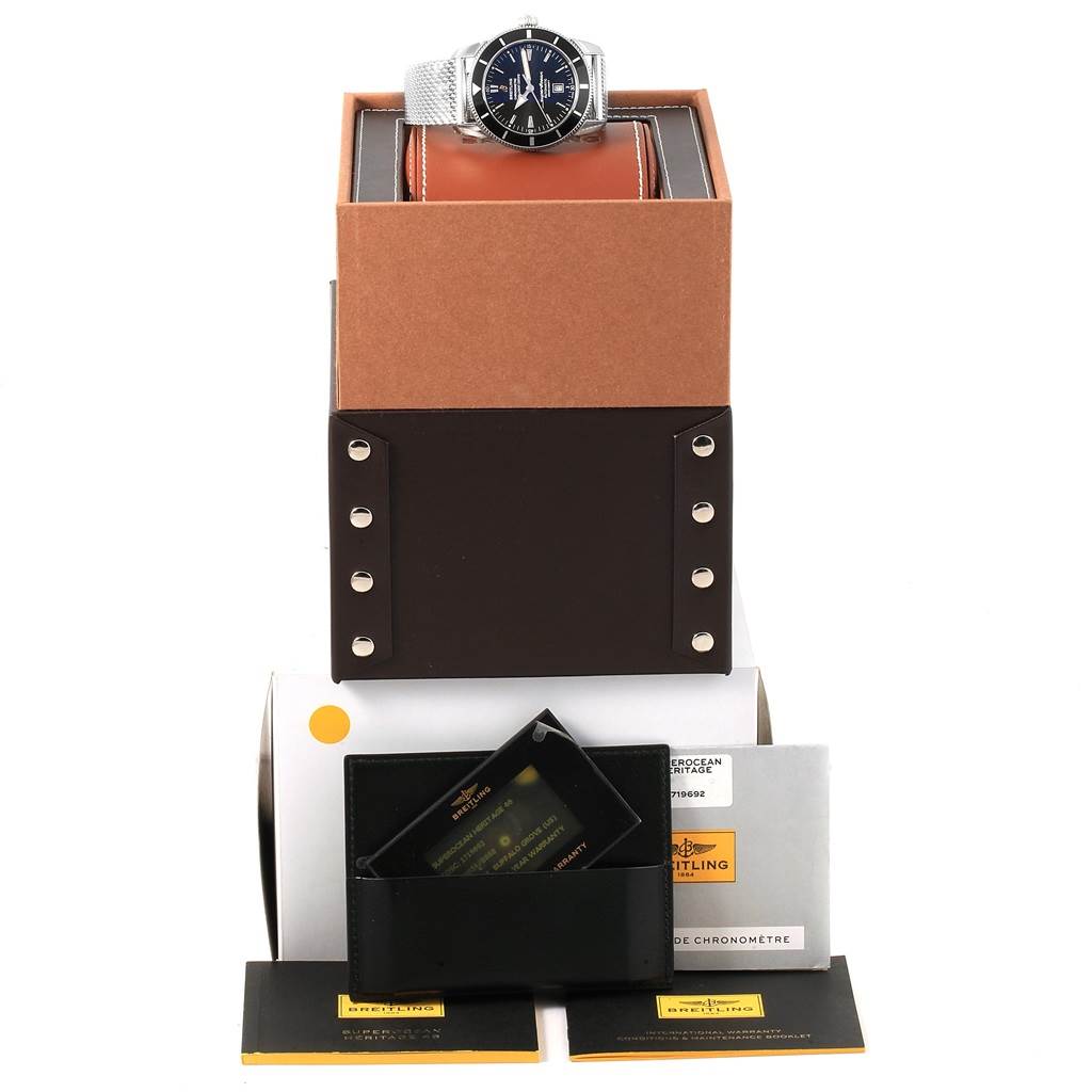 The Breitling Navitimer A17320 Men
s Stainless Steel Black Dial A17320 Men
s Stainless Steel Black Dial watch is shown from above, placed on its open box with accompanying documents and accessories.