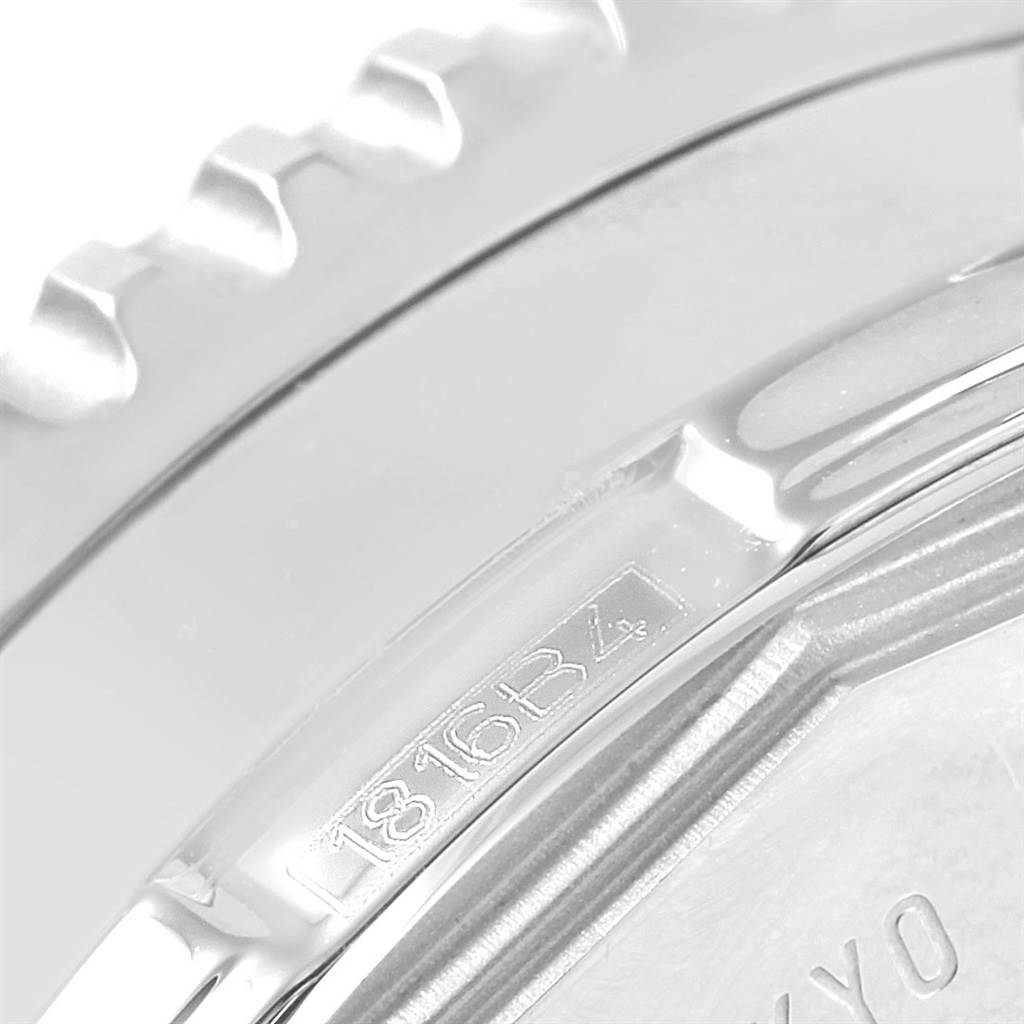 This close-up image displays the case back and part of the bezel of a Breitling Navitimer A24322 Men
s Stainless Steel Blue Dial A24322 Men
s Stainless Steel Blue Dial watch, featuring a serial number.