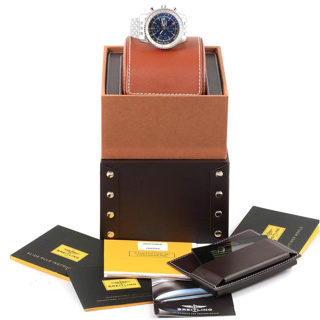 The Breitling Navitimer A24322 Men
s Stainless Steel Blue Dial A24322 Men
s Stainless Steel Blue Dial watch is shown from a front angle, atop its box with accompanying manuals and documentation.