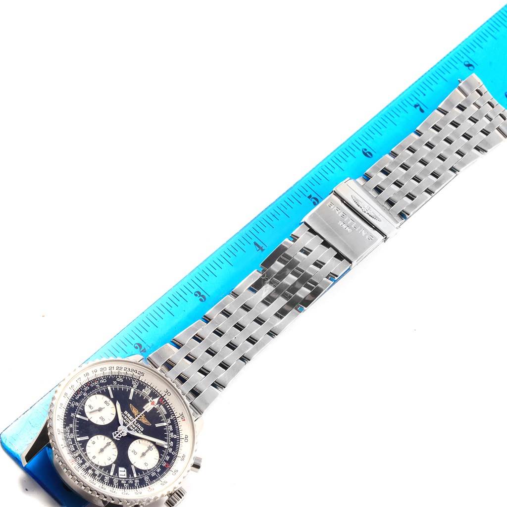 The image shows the face and the metal bracelet of a Breitling Navitimer A23322 Men's Stainless Steel Silver Dial A23322 Men's Stainless Steel Silver Dial watch, measured against a blue ruler.
