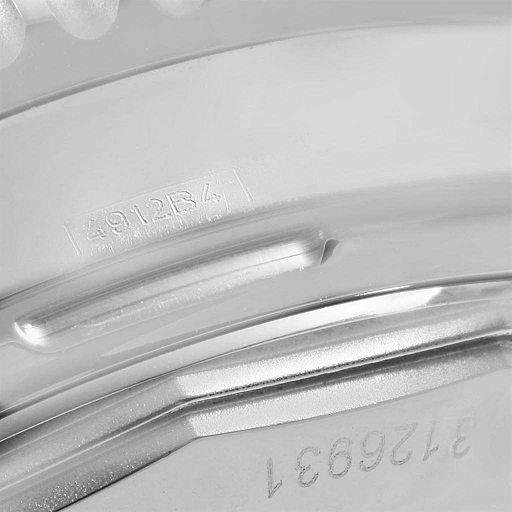 This close-up image shows the engraved serial numbers on the casing of the Breitling Navitimer AB0125 Men's Stainless Steel Blue Dial AB0125 Men's Stainless Steel Blue Dial watch.