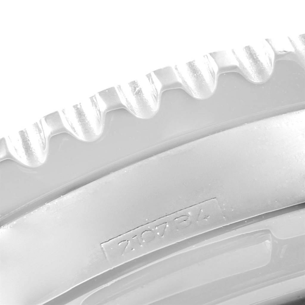 This close-up image shows the ridged bezel edge and a partial serial number of the Breitling Navitimer A23322 Men's Stainless Steel Silver Dial A23322 Men's Stainless Steel Silver Dial watch.