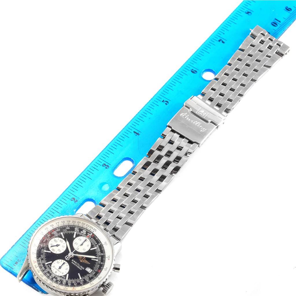 The image shows a Breitling Navitimer A13322 Men's Stainless Steel Black Dial A13322 Men's Stainless Steel Black Dial watch with a stainless steel bracelet, photographed from an overhead angle next to a ruler.