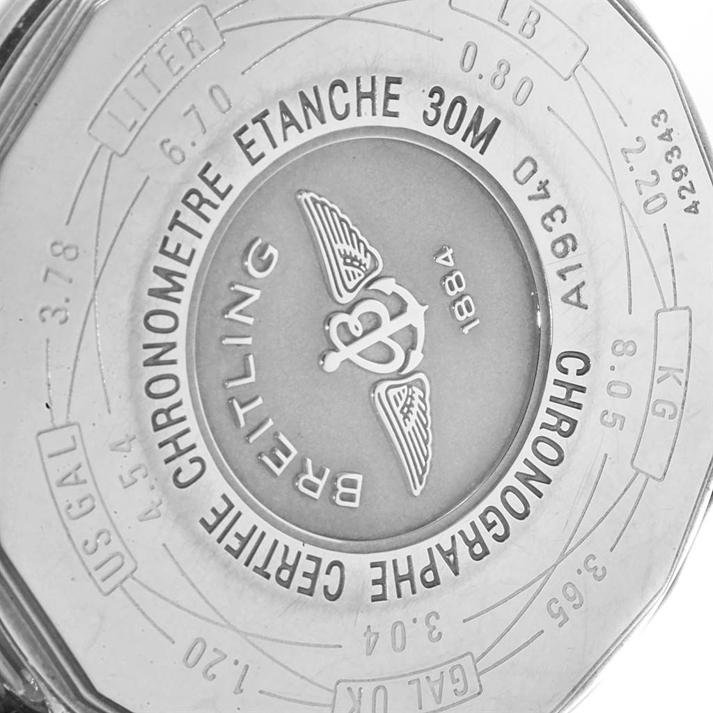 This is the back of a Breitling Navitimer A19340 Men's Stainless Steel Blue Dial A19340 Men's Stainless Steel Blue Dial watch, showing inscriptions and the brand's logo.