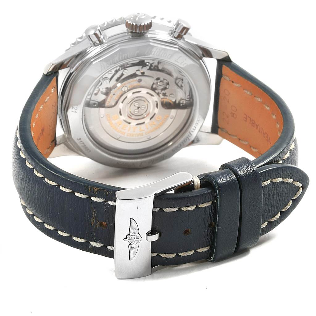 This image shows the back of a Breitling Navitimer AB0121 Men's Stainless Steel Blue Dial AB0121 Men's Stainless Steel Blue Dial watch, displaying its see-through case back and leather strap with a buckle.