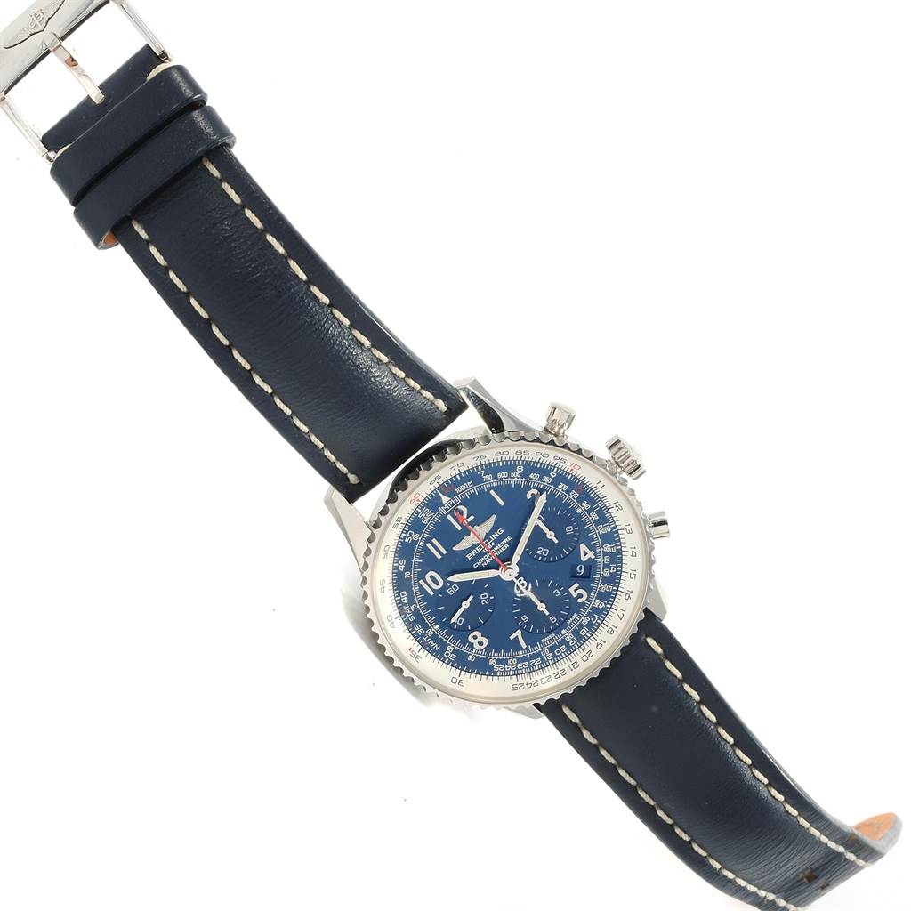 The image shows a Breitling Navitimer AB0121 Men's Stainless Steel Blue Dial AB0121 Men's Stainless Steel Blue Dial watch with a blue face, exposed crown and pushers from a top-down angle.