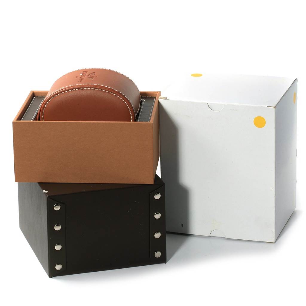 The image shows the packaging of the Breitling Navitimer AB012721-BD09SS Men
s Stainless Steel Black Dial AB012721-BD09SS Men
s Stainless Steel Black Dial, including a leather case, a brown inner box, and a white outer box.