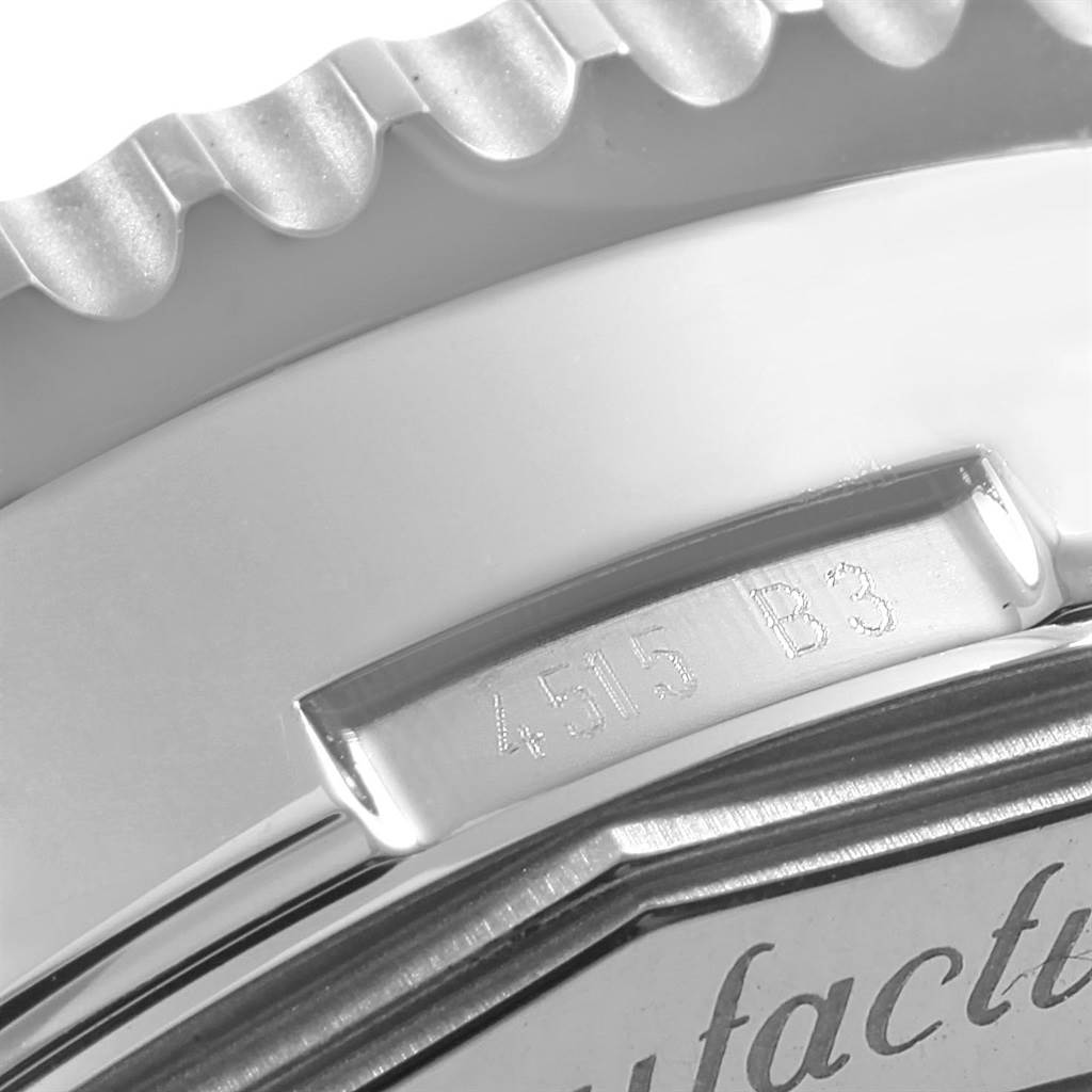 The image shows a close-up of the bezel and part of the case back of a Breitling Navitimer AB012721-BD09SS Men
s Stainless Steel Black Dial AB012721-BD09SS Men
s Stainless Steel Black Dial watch.