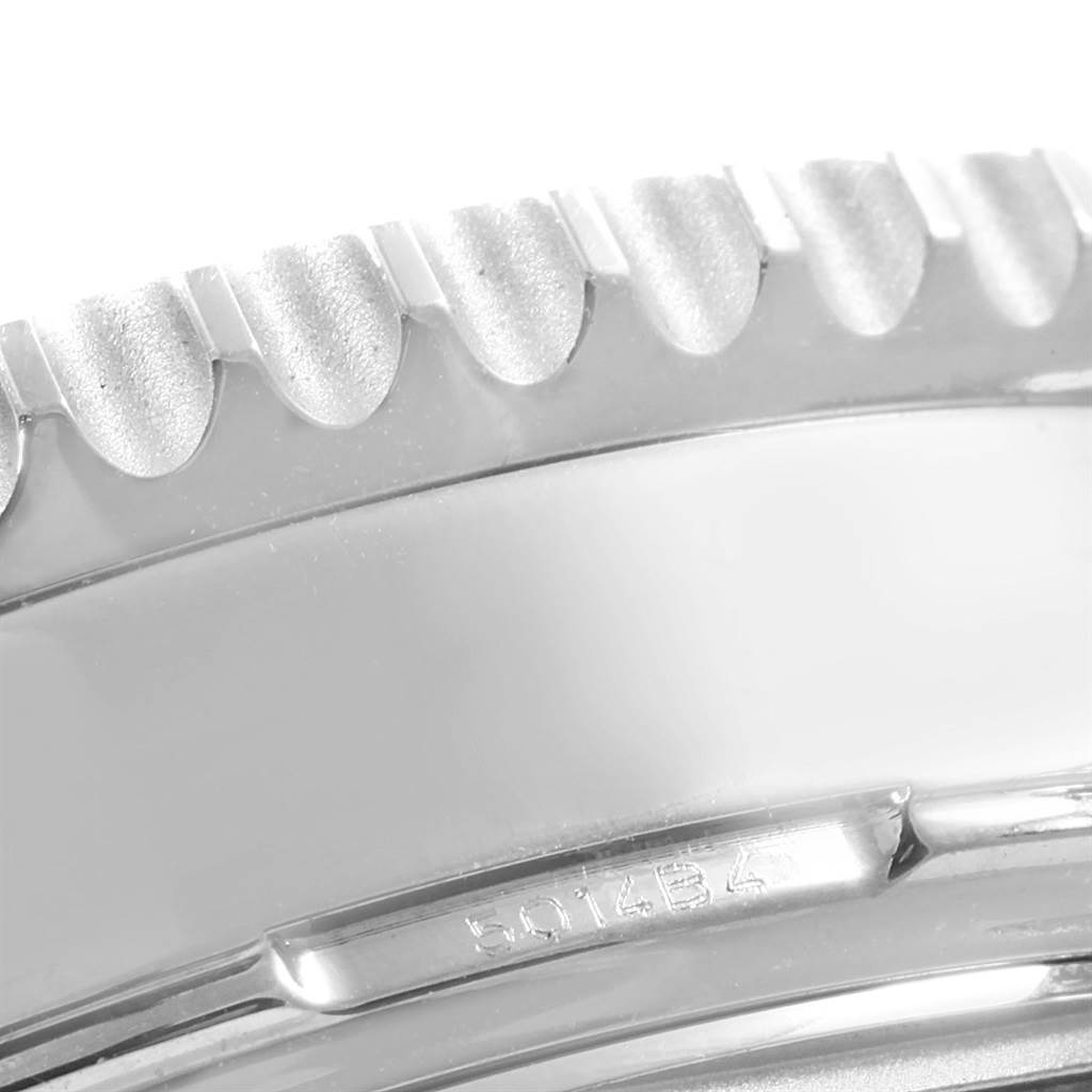 The image shows a close-up, angled view of the bezel and part of the case of a Breitling Navitimer AB044121-G783-453A Men
s Stainless Steel Silver Dial AB044121-G783-453A Men
s Stainless Steel Silver Dial watch.