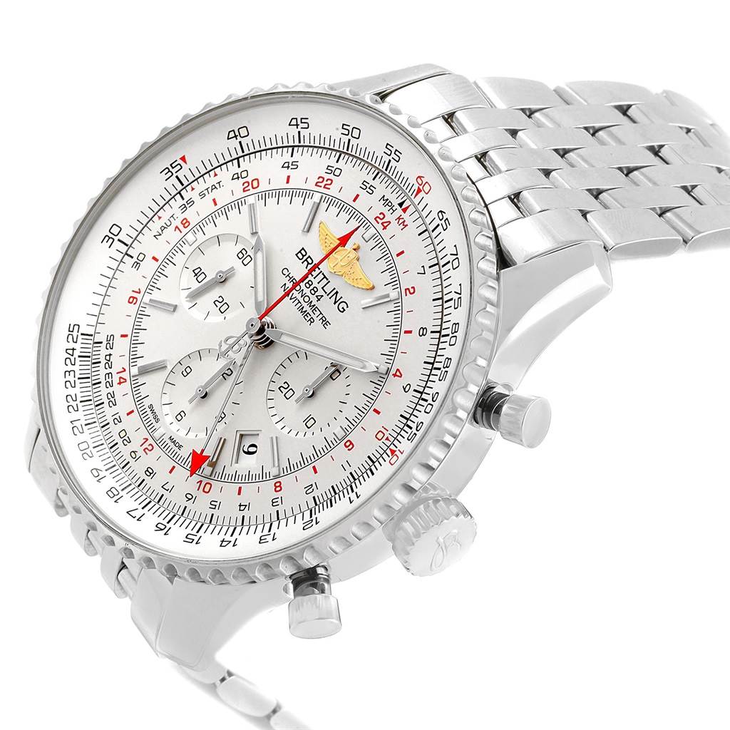 The image shows a side angle of a Navitimer by Breitling, highlighting the dial, bezel, and chronograph pushers.
