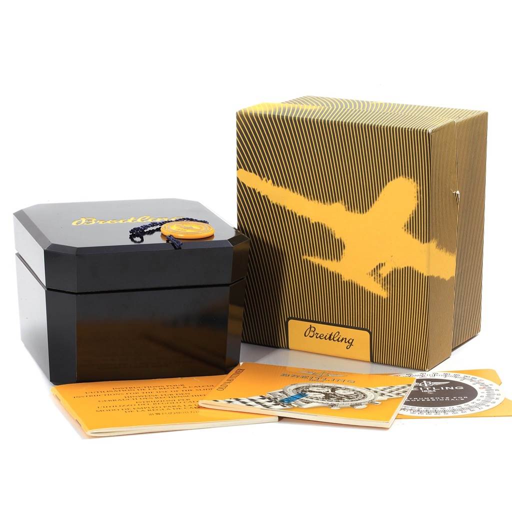 The image shows the packaging and accessories for a Breitling Navitimer A13322 Men
s Stainless Steel Black Dial A13322 Men
s Stainless Steel Black Dial watch, including a watch box, outer box, manuals, and a medallion.