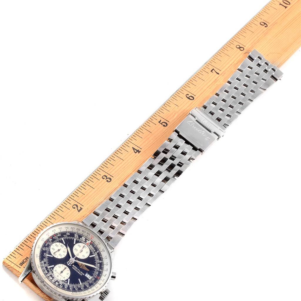 The image shows a Breitling Navitimer A13322 Men
s Stainless Steel Black Dial A13322 Men
s Stainless Steel Black Dial watch laid flat next to a ruler, displaying the face, case, and metal bracelet.