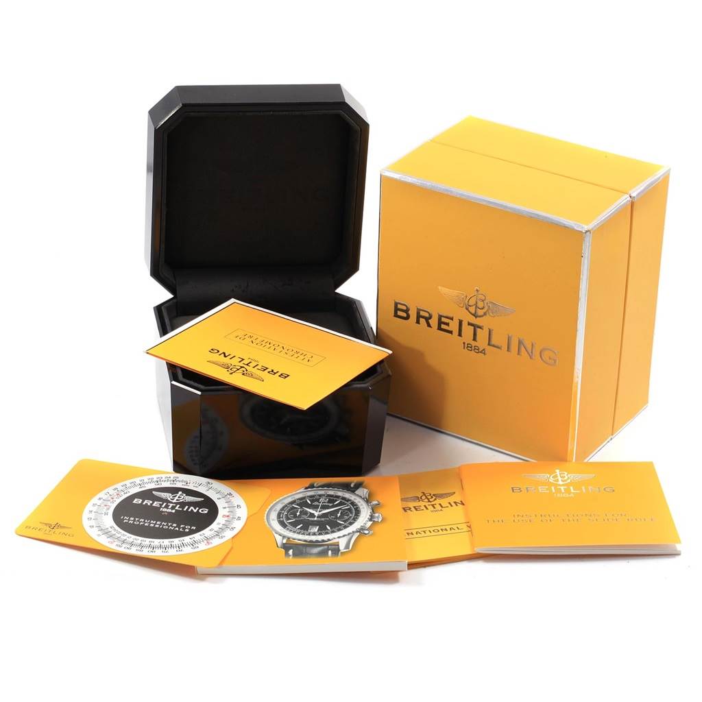 The image shows the Breitling Navitimer A48330 Men
s Stainless Steel Black Dial A48330 Men
s Stainless Steel Black Dial watch
s packaging and accompanying accessories, including the box, manuals, and warranty cards.