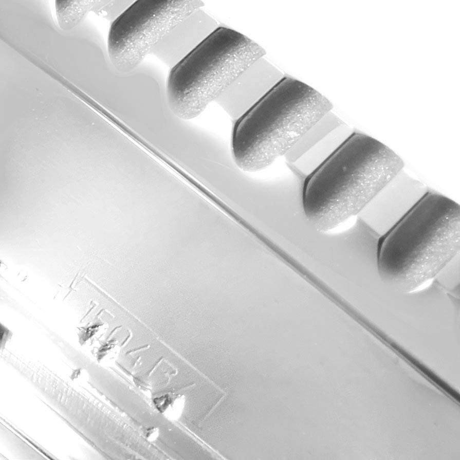 This image shows a close-up of the bezel of a Breitling Navitimer A23322 Men
s Stainless Steel Black Dial A23322 Men
s Stainless Steel Black Dial watch.