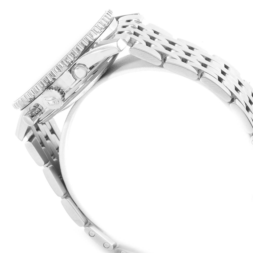 The image shows a side view of a Breitling Navitimer AB012721-BD09-453A Men's Stainless Steel Black Dial AB012721-BD09-453A Men's Stainless Steel Black Dial watch, focusing on the crown, bezel, and metal bracelet.