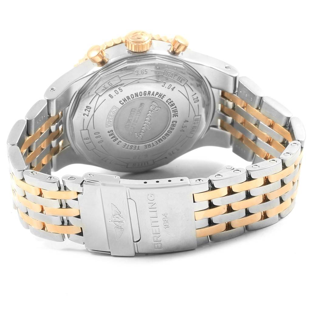 The image shows the back case, crown, and two-tone metal bracelet of a Breitling Navitimer C23340 Men's Steel and Gold (two tone) Brown Dial C23340 Men's Steel and Gold (two tone) Brown Dial watch.