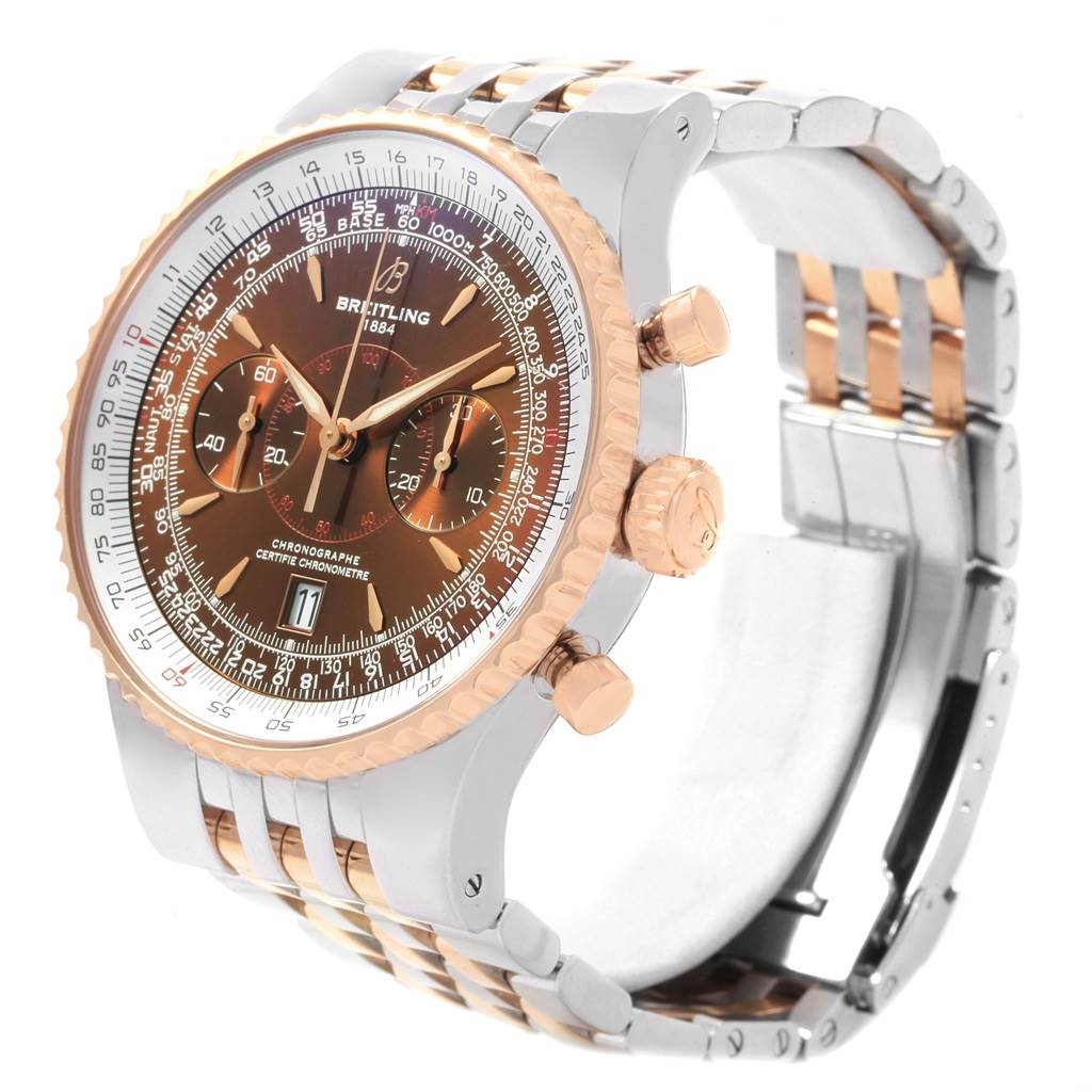 The image shows a Breitling Navitimer C23340 Men's Steel and Gold (two tone) Brown Dial C23340 Men's Steel and Gold (two tone) Brown Dial watch at a three-quarter angle, highlighting its dial, bezel, crown, chronograph buttons, and bracelet.