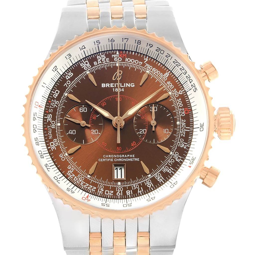 The image shows a frontal view of a Breitling Navitimer C23340 Men's Steel and Gold (two tone) Brown Dial C23340 Men's Steel and Gold (two tone) Brown Dial watch, highlighting its dial, subdials, bezel, and bracelet.