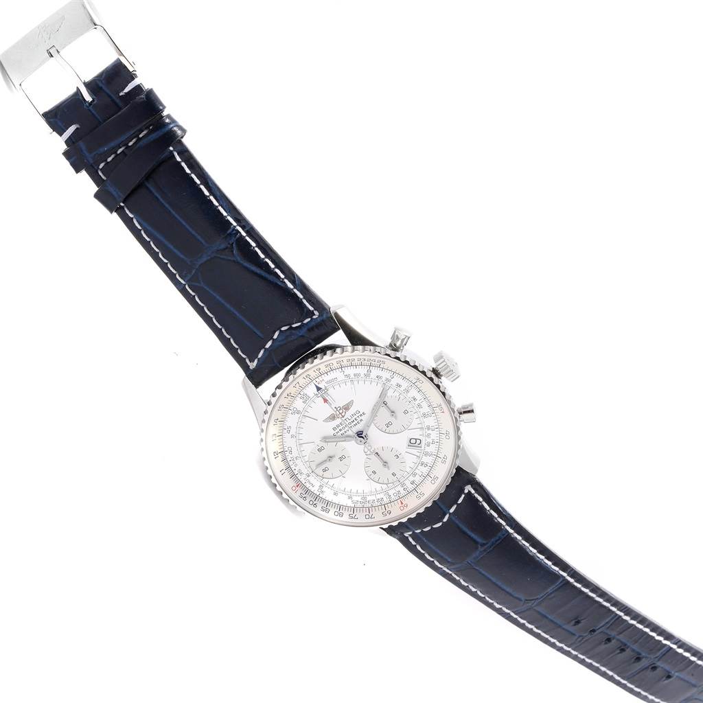 The Breitling Navitimer A23322 Men's Stainless Steel Silver Dial A23322 Men's Stainless Steel Silver Dial watch is shown from an angled overhead view, highlighting its face, bezel, and entire leather strap.