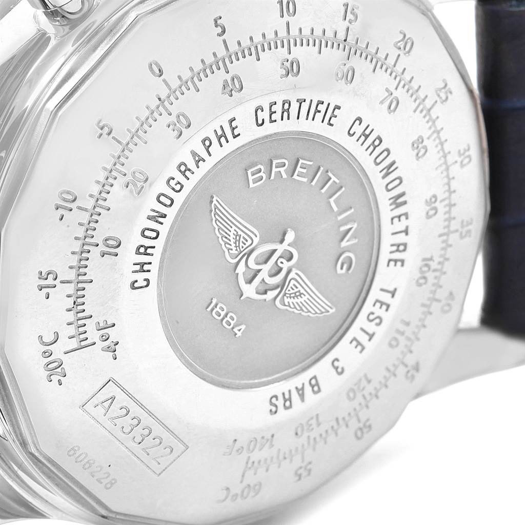 The image shows the back of a Breitling Navitimer A23322 Men's Stainless Steel Silver Dial A23322 Men's Stainless Steel Silver Dial watch, displaying inscriptions, serial numbers, and company logo.